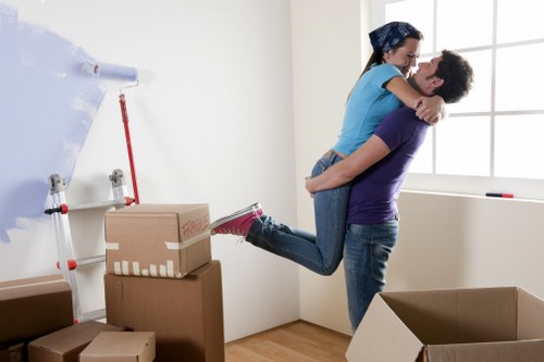 Removal staff wearing PPE while handling furniture