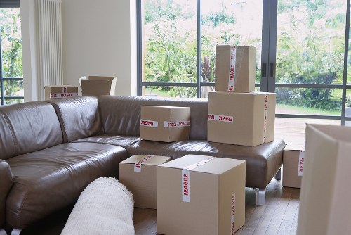 Team removing bulky sofa and household furniture in Towerhill